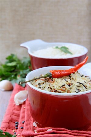 person with hot pepper - Bowls of uncooked rice and chili peppers Asian Still Life Stock Photo - Budget Royalty-Free & Subscription, Code: 400-04798913