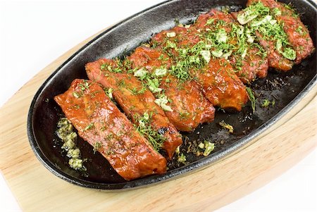 slab of roast - Spare ribs and greens closeup for dinner at pan isolated on a white Stock Photo - Budget Royalty-Free & Subscription, Code: 400-04799149