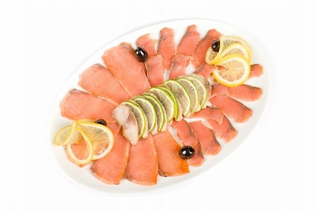 peces pargo - Sliced chum salmon and mackerel closeup decorated with limes, lemons and olives Foto de stock - Super Valor sin royalties y Suscripción, Código: 400-04799142