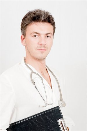 simsearch:400-05192324,k - pretty male doctor with medical stethoscope Stock Photo - Budget Royalty-Free & Subscription, Code: 400-04799572