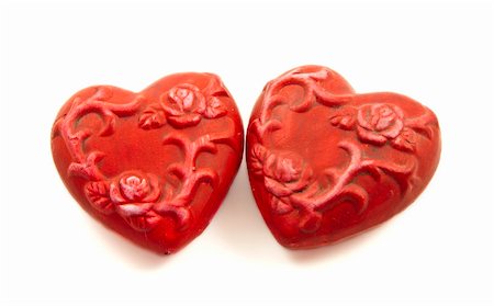 Two ceramic red hearts isolated on a white background Fotografie stock - Microstock e Abbonamento, Codice: 400-04799698
