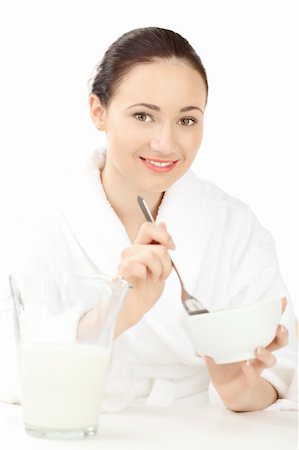 simsearch:400-08977333,k - Happy woman in bathrobe  for breakfast over white Stock Photo - Budget Royalty-Free & Subscription, Code: 400-04790122