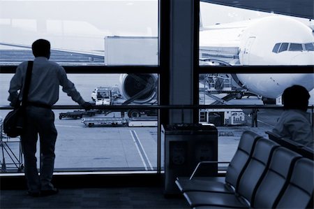 plane delay - the business man at the airport. Stock Photo - Budget Royalty-Free & Subscription, Code: 400-04790143