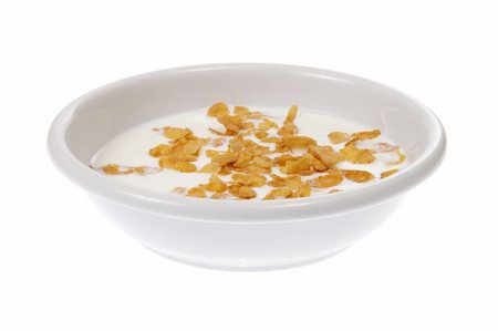 Bowl with corn flakes and milk, photo on white Stock Photo - Budget Royalty-Free & Subscription, Code: 400-04790278