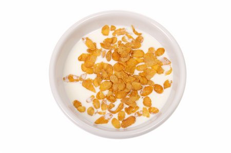 Bowl with corn flakes and milk, photo on white Foto de stock - Super Valor sin royalties y Suscripción, Código: 400-04790279