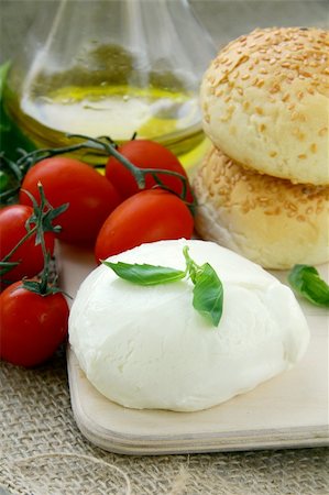 scenic dinner - Italian  mozzarella cheese tomatoes olive oil and bread still life Stock Photo - Budget Royalty-Free & Subscription, Code: 400-04790573