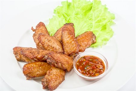 simsearch:400-07215165,k - chicken roasted wing dish with sauce on a white background Stock Photo - Budget Royalty-Free & Subscription, Code: 400-04790818