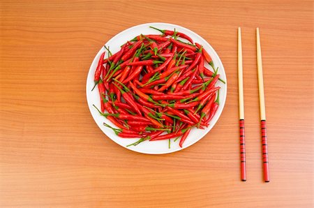 simsearch:400-04288181,k - Hot peppers with chopsticks and plate Photographie de stock - Aubaine LD & Abonnement, Code: 400-04790906