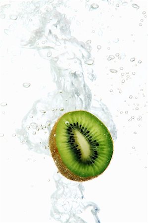 Fresh kiwi dropped into water Stock Photo - Budget Royalty-Free & Subscription, Code: 400-04790952