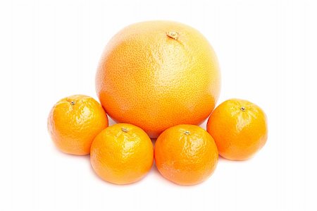 Grapefruit and mandarin on white background Foto de stock - Royalty-Free Super Valor e Assinatura, Número: 400-04791174