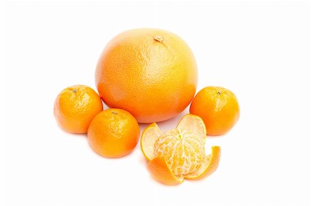 Grapefruit and mandarin on white background Foto de stock - Royalty-Free Super Valor e Assinatura, Número: 400-04791178