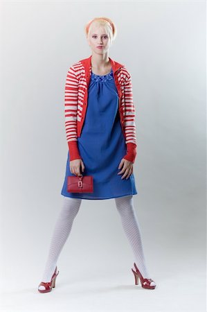 emotion pose blond girl in red woolly Stockbilder - Microstock & Abonnement, Bildnummer: 400-04791240