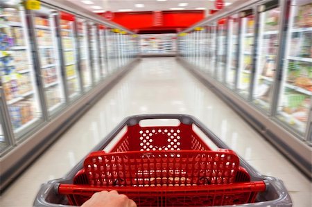 shoppers blurry marketplace - A fast food concept motion blur shot of a shopping trolley being pushed down the aisle of a supermarket Stock Photo - Budget Royalty-Free & Subscription, Code: 400-04791582