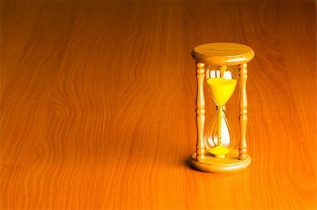 Time concept with hourglass against background Stock Photo - Budget Royalty-Free & Subscription, Code: 400-04791591