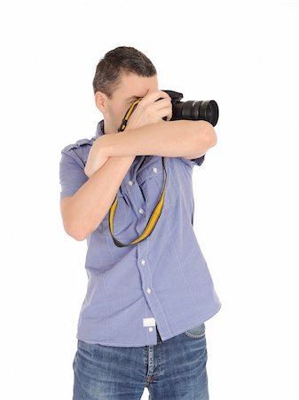 professional male photographer taking picture . isolated on white background Stock Photo - Budget Royalty-Free & Subscription, Code: 400-04792605