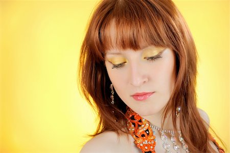 Beautiful woman with golden make-up. yellow background Stock Photo - Budget Royalty-Free & Subscription, Code: 400-04792618