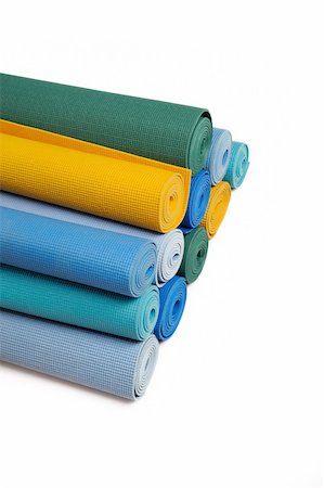 many colorfull yoga mats as a background. isolated on white background Stock Photo - Budget Royalty-Free & Subscription, Code: 400-04792634