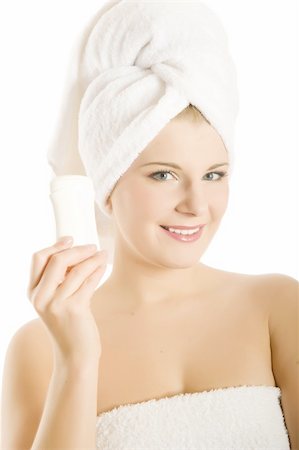 simsearch:400-04194380,k - Young beautiful healthy woman with white towel on her head holding anti persperant stick Stock Photo - Budget Royalty-Free & Subscription, Code: 400-04792639