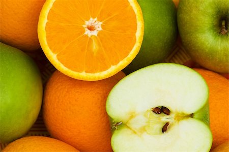 simsearch:400-04243170,k - Close up of half cut oranges and apples Stock Photo - Budget Royalty-Free & Subscription, Code: 400-04792717
