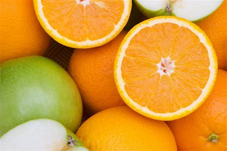 simsearch:400-04243170,k - Close  up of half cut oranges and apples Stock Photo - Budget Royalty-Free & Subscription, Code: 400-04792718