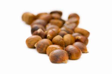 Many chestnuts isolated on the white background Fotografie stock - Microstock e Abbonamento, Codice: 400-04792931