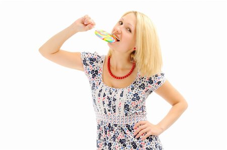 Attractive blonde eating lollipop Stock Photo - Budget Royalty-Free & Subscription, Code: 400-04793072