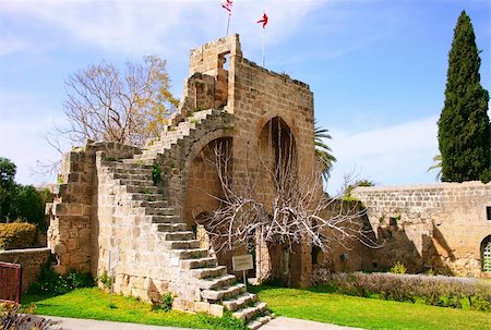 religious art cyprus - Historic Bellapais Abbey in Kyrenia, Northern Cyprus.Original construction was built between 1198-1205, it is the most beautiful Gothic building in the Near East. Foto de stock - Super Valor sin royalties y Suscripción, Código: 400-04793767