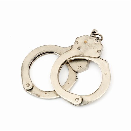 simsearch:400-05300234,k - steel metallic handcuffs (manacles) isolated on white background Fotografie stock - Microstock e Abbonamento, Codice: 400-04793808