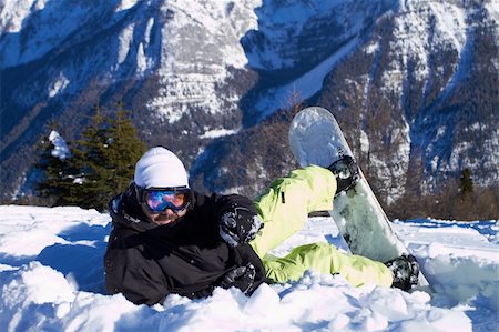 simsearch:400-04289173,k - Male snowboarder laying on snow and resting Stock Photo - Budget Royalty-Free & Subscription, Code: 400-04793873