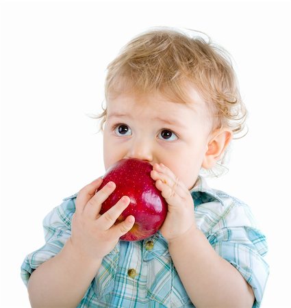Beautiful baby boy eats red apple. Closeup portrait.  Isolated. Fotografie stock - Microstock e Abbonamento, Codice: 400-04804009