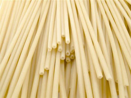 A considerable quantity of crude spaghetti create a beautiful background Stock Photo - Budget Royalty-Free & Subscription, Code: 400-04804316