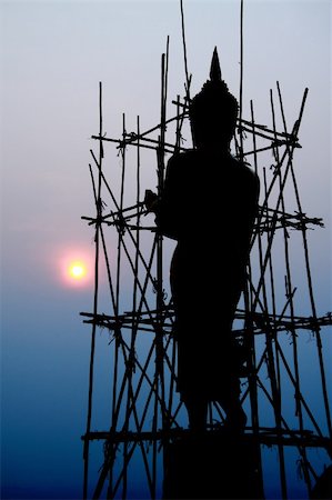 silhouette of renovation buddha in the morning and sun on the sky Stock Photo - Budget Royalty-Free & Subscription, Code: 400-04804373