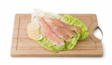 salmon trout dish - Assorted Trout on light green leaf with lemon isolated on a white background Stock Photo - Budget Royalty-Free & Subscription, Code: 400-04804638