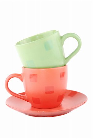 simsearch:400-06461761,k - Multi-coloured cups on a support on a white background Fotografie stock - Microstock e Abbonamento, Codice: 400-04804812