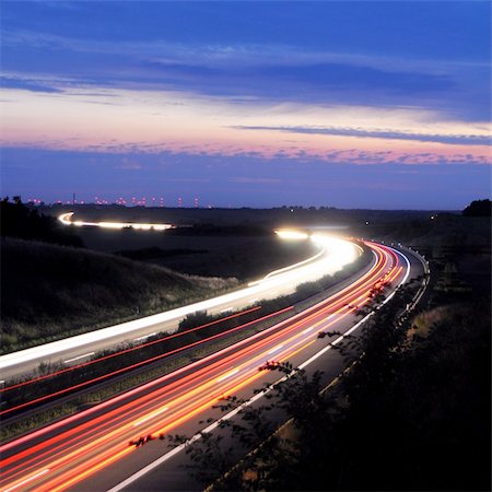night traffic on busy highway with cars lights and blue sky Stock Photo - Budget Royalty-Free & Subscription, Code: 400-04804927