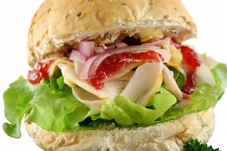 simsearch:400-04055000,k - Turkey and lettuce with red onions and cranberry sauce on a wholemeal roll. Photographie de stock - Aubaine LD & Abonnement, Code: 400-04806004