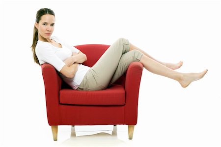 simsearch:400-04398921,k - Young woman sitting on a chair on white background studio Stockbilder - Microstock & Abonnement, Bildnummer: 400-04806084