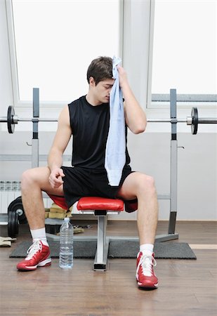 picture of a thin boy - young man in fintess sport club exercise withweights and relaxing Stock Photo - Budget Royalty-Free & Subscription, Code: 400-04806370