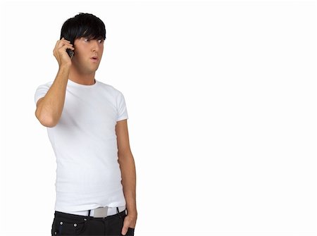 young brunette guy speaking on his cell phone Stock Photo - Budget Royalty-Free & Subscription, Code: 400-04807391