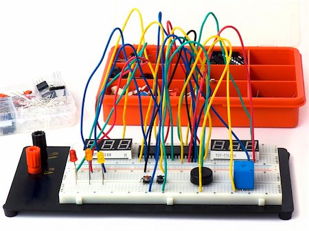 Electronic circuit on a breadboard and electronic components isolated on white background Foto de stock - Super Valor sin royalties y Suscripción, Código: 400-04807866