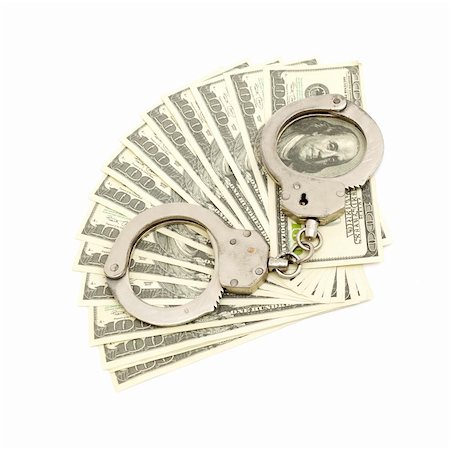 Handcuffs on money background, business security concept Stock Photo - Budget Royalty-Free & Subscription, Code: 400-04807905