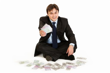 simsearch:400-07670619,k - Successful businessman sitting on floor surrounded by money isolated on white Stock Photo - Budget Royalty-Free & Subscription, Code: 400-04808025