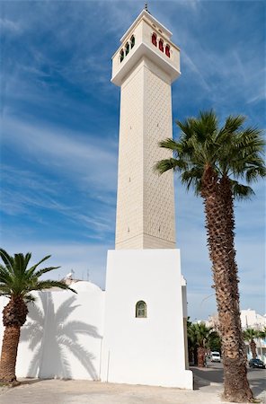 sousse - Minaret against the blue sky and surrounded by two palm trees in the city of Sousse, Tunisia Foto de stock - Super Valor sin royalties y Suscripción, Código: 400-04808210