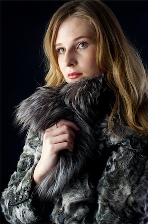 simsearch:400-05051542,k - beautiful woman in a fur coat at black background Stock Photo - Budget Royalty-Free & Subscription, Code: 400-04808211