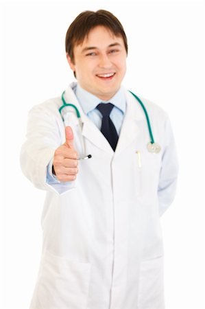 Smiling medical doctor showing thumbs up gesture isolated on white Stock Photo - Budget Royalty-Free & Subscription, Code: 400-04808256