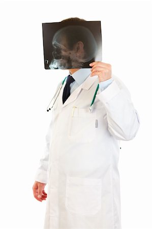 simsearch:400-04508758,k - Smiling medical doctor holding heads roentgen in front of his head isolated on white Foto de stock - Super Valor sin royalties y Suscripción, Código: 400-04808275