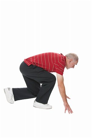 Healthy elderly man in squatting position, ready to sprint.  Isolated on white background. Foto de stock - Super Valor sin royalties y Suscripción, Código: 400-04808879