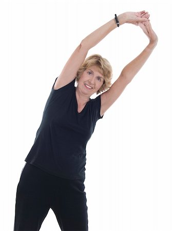 Active elderly woman performing arm stretch to keep muscle tone.  Isolated on white background. Stock Photo - Budget Royalty-Free & Subscription, Code: 400-04808885