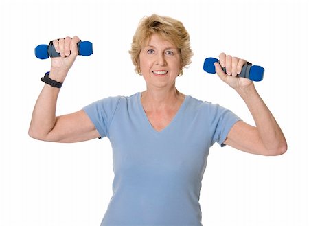 Smiling elderly woman exercising with hand weights to strengthen arm muscles Foto de stock - Super Valor sin royalties y Suscripción, Código: 400-04808882