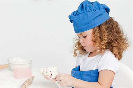 rolling over - Little girl baking in the kitchen at home Stock Photo - Budget Royalty-Free & Subscription, Code: 400-04809155